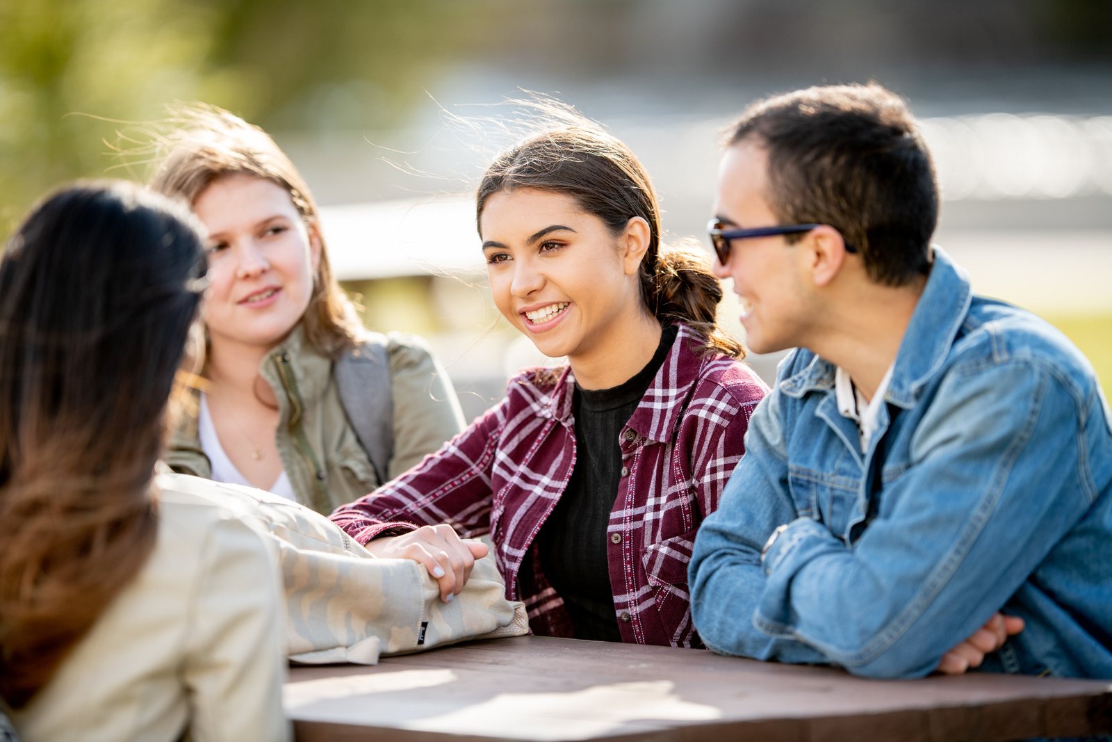 Students talking together at an outdoor table
